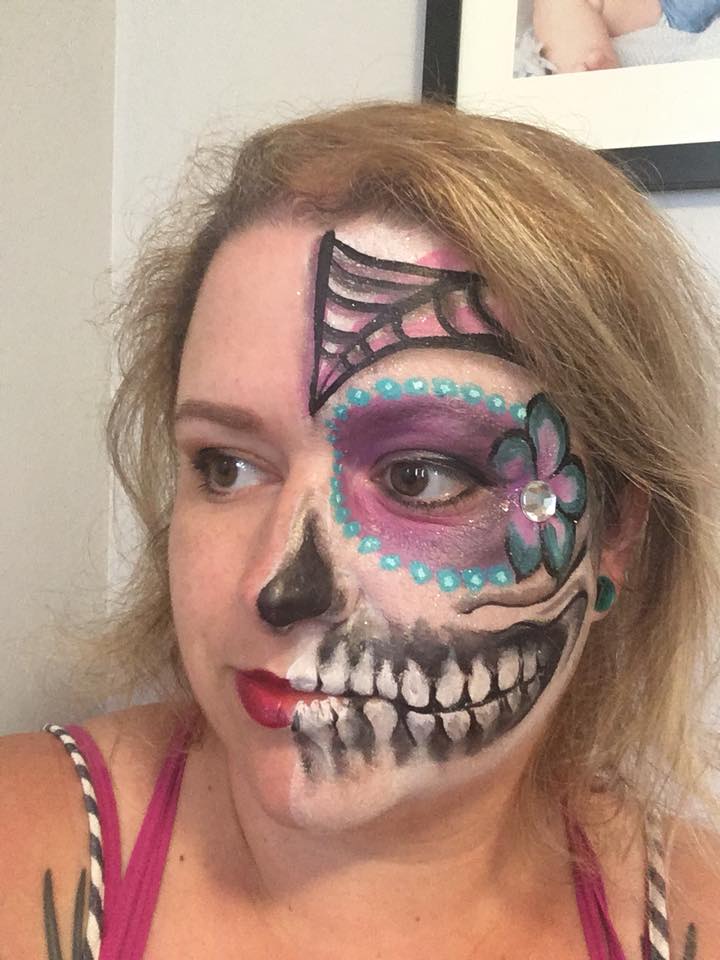 Adult with creative skull face painting design